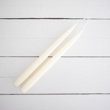 Hand-Dipped Danish Tapers - Cream styled on a white back. Styled view. 