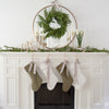 Hand-Dipped Danish Tapers - Cream styled with candlesticks and garland on a white mantel. Styled view. 