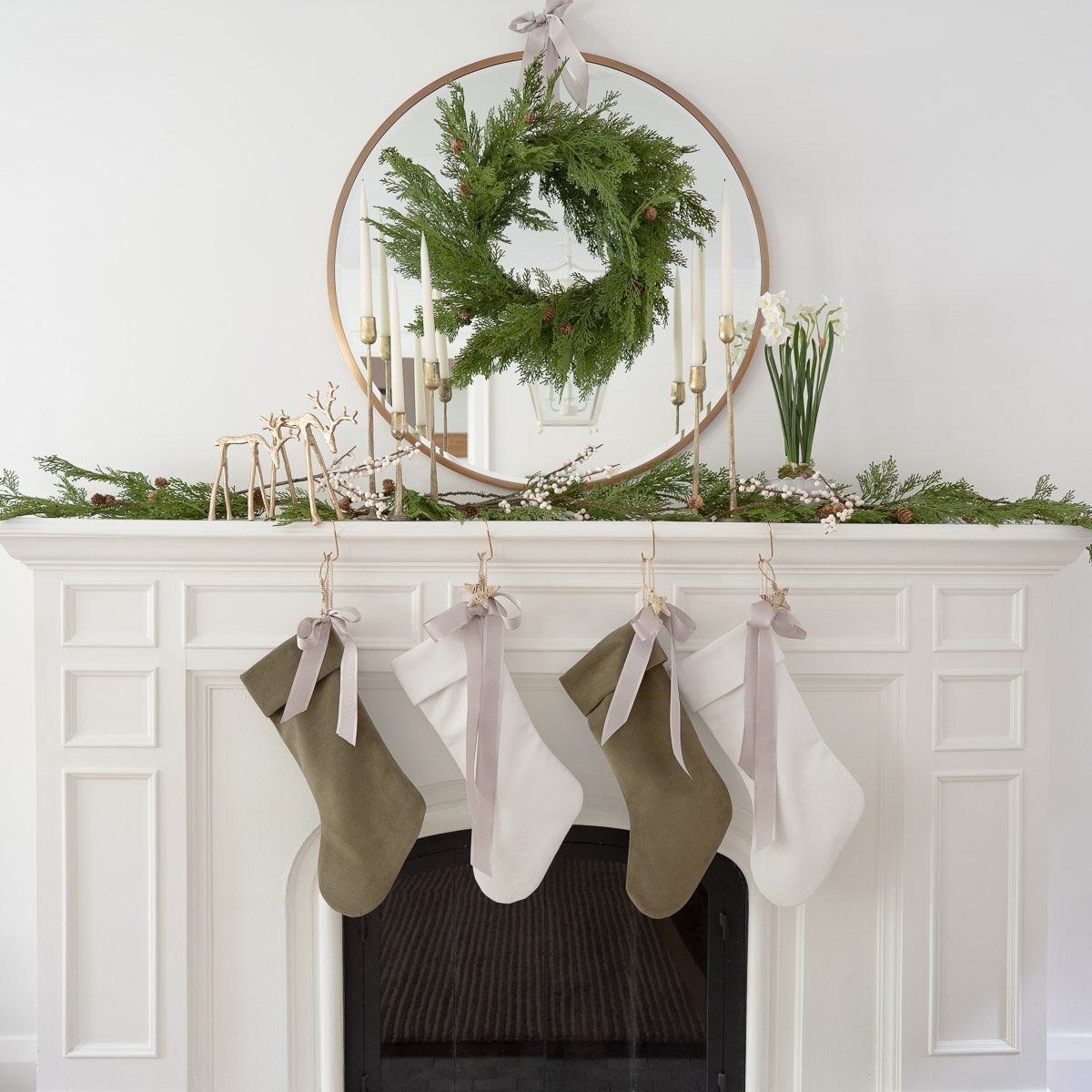 Hand-Dipped Danish Tapers - Cream styled with candlesticks and garland on a white mantel. Styled view. 