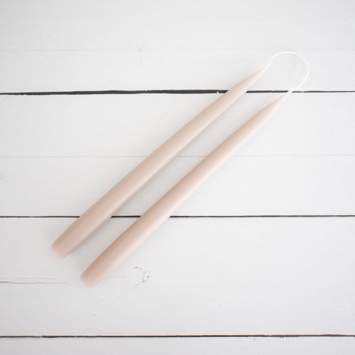 Hand-Dipped Danish Tapers - Linen styled on white surface. Styled view.