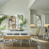 Heidi Bench styled with wicker chairs beside a white kitchen. Styled view.