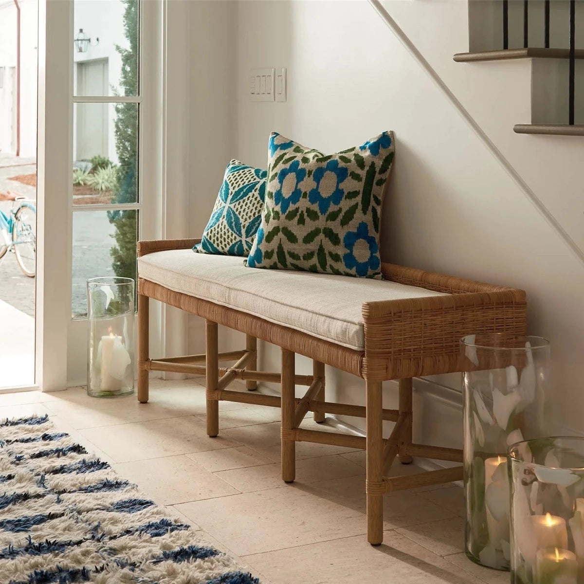 Heidi Bench styled with pillows in an entryway. Styled view.