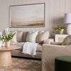 Henry Sofa styled with neutral and green pillows with a white throw blanket. Styled view. 