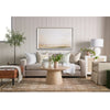 Henry Sofa styled in a white room with leather ottoman and spring decor. Styled view. 