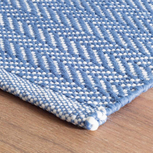 Herringbone French Blue/White Indoor/Outdoor Rug corner detail. Close-up detail view. 