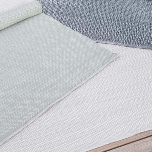 Herringbone Pearl Grey/White Indoor/Outdoor Rug styled with herringbone rugs. Styled view. 
