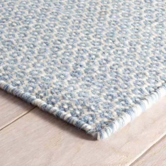 Honeycomb French Blue/Ivory Woven Wool Rug corner detail. Close-up detail view. 