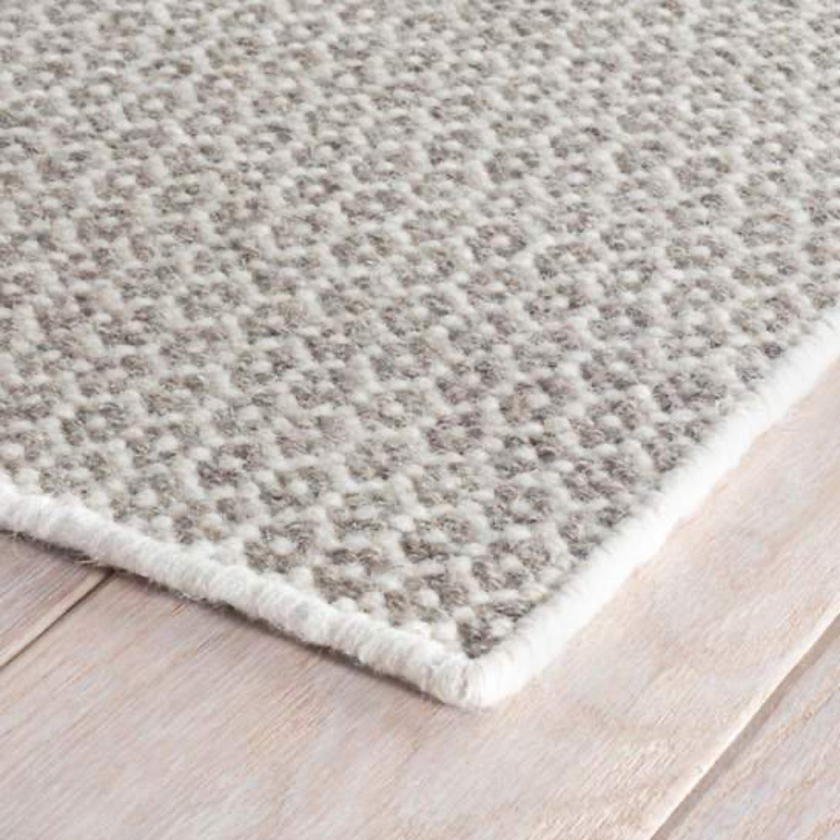 Honeycomb Ivory/Grey Woven Wool Rug corner detail. Close-up detail view. 