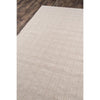 Huron Indoor/Outdoor Rug - Beige over wood floor. Styled view.