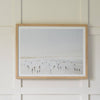 Idyllic Surf hung on a white panel wall. Styled view.