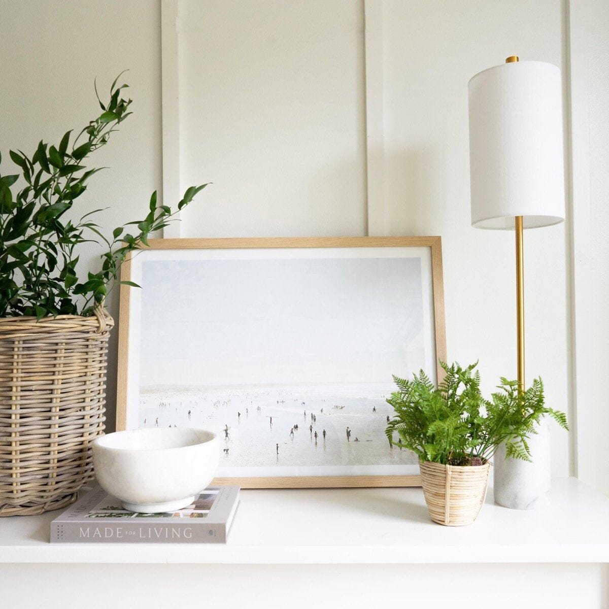 Idyllic Surf styled on a white table with decor. Styled view.