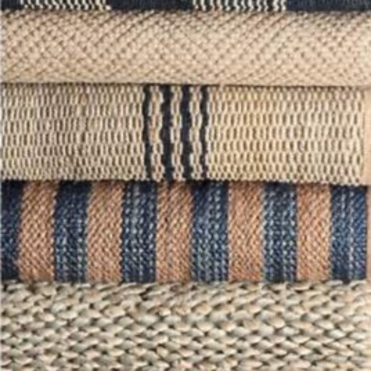 Jute Ticking Indigo Woven Rug styled with neutral rugs. Styled view. 