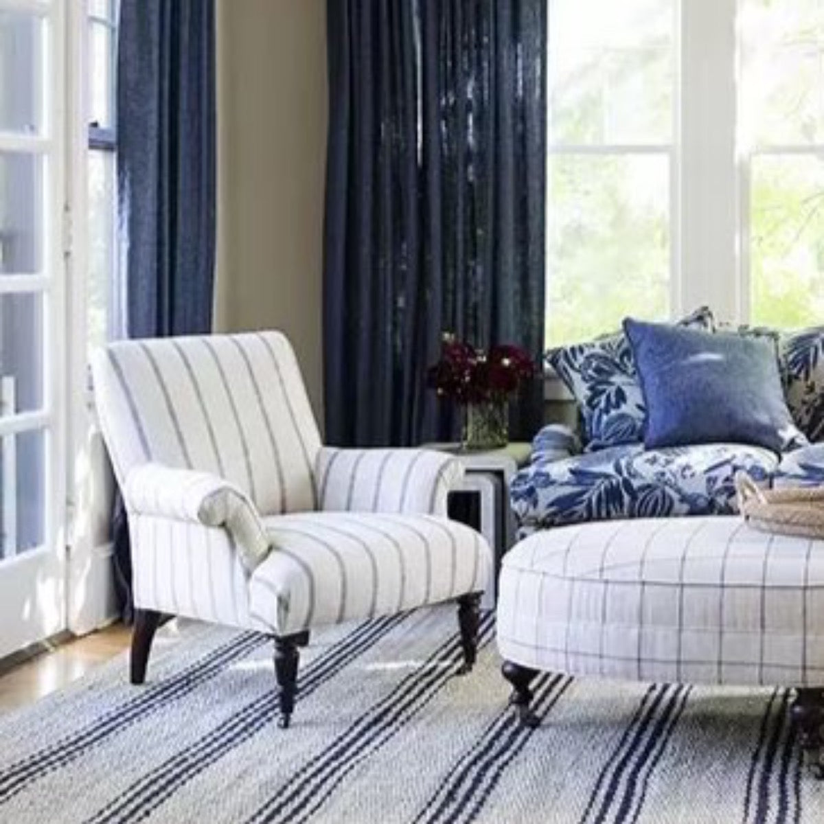 Jute Ticking Indigo Woven Rug styled in a navy living room. Styled view. 