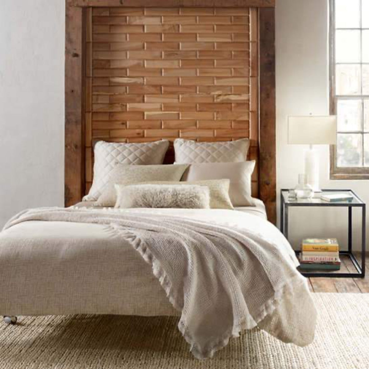 Jute Woven Bleached Oak Rug styled in a neutral bedroom. Styled view. 