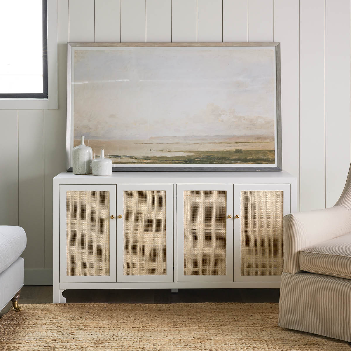 Jute Woven Natural Rug styled in a neutral living room. Styled view.