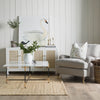 Jute Woven Natural Rug styled in a neutral living room. Styled view. 