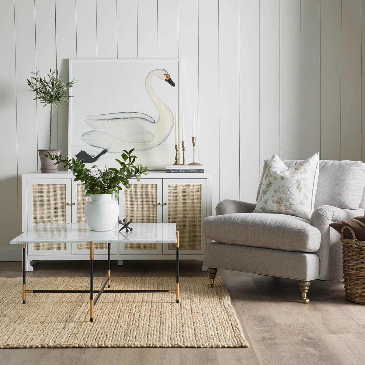 Jute Woven Natural Rug styled in a neutral living room. Styled view. 