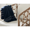 Kinsley Accent Chair styled with a blue throw. Detail view.