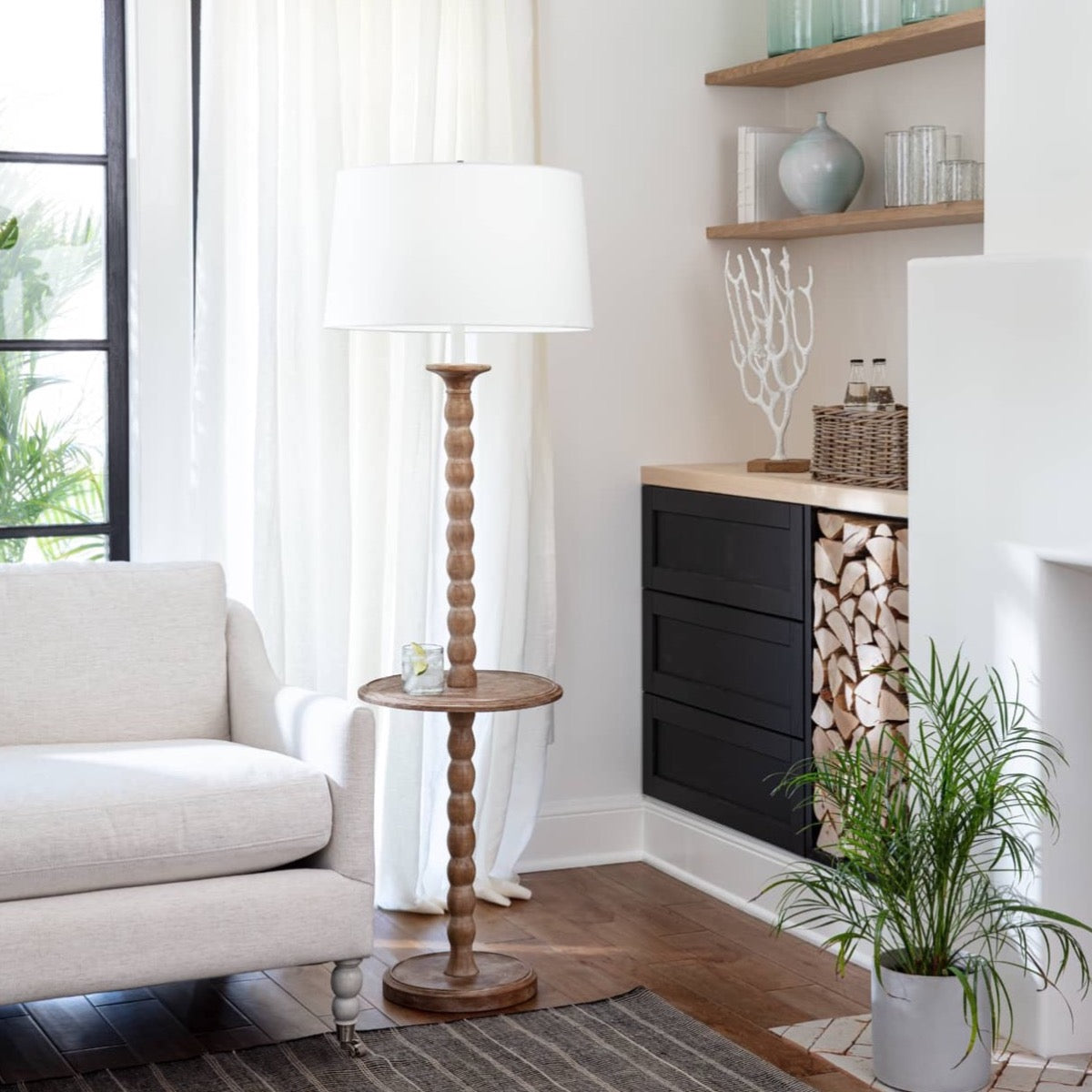Perennial Floor Lamp Floor Lamp styled in a neutral living room. Styled view.