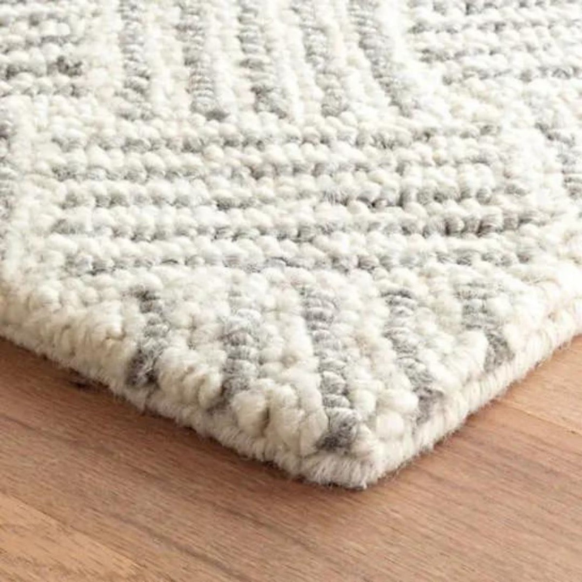Layers Hooked Wool Rug corner detail. Close-up detail view. 
