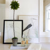 Long Marble Tray styled with greenery, soaps and artwork. Styled view. 