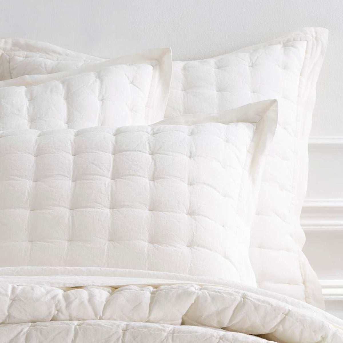Lush Linen Ivory Puff Sham styled with white sheets. Styled view. 
