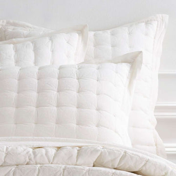 Lush Linen Ivory Puff Sham styled with white sheets. Styled view. 