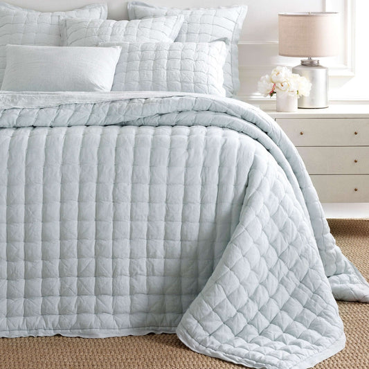 Lush Linen Sky Puff styled with white bedding. Styled view. 