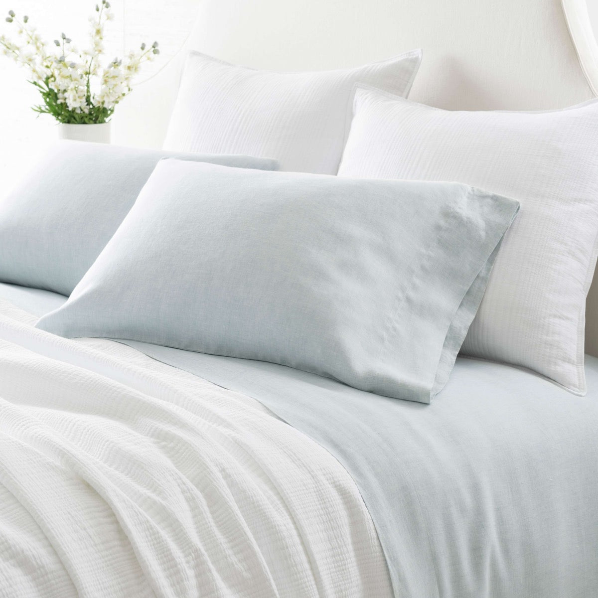 Lush Linen Sky Sheet Set styled with white bedding. Styled view. 