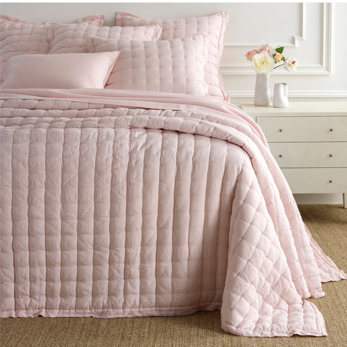 Lush Linen Slipper Pink Puff styled with pink sheets. Styled view. 