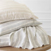 Lush Linen Stripe Slate Blue Duvet Cover styled with pillow inserts. Styled view. 