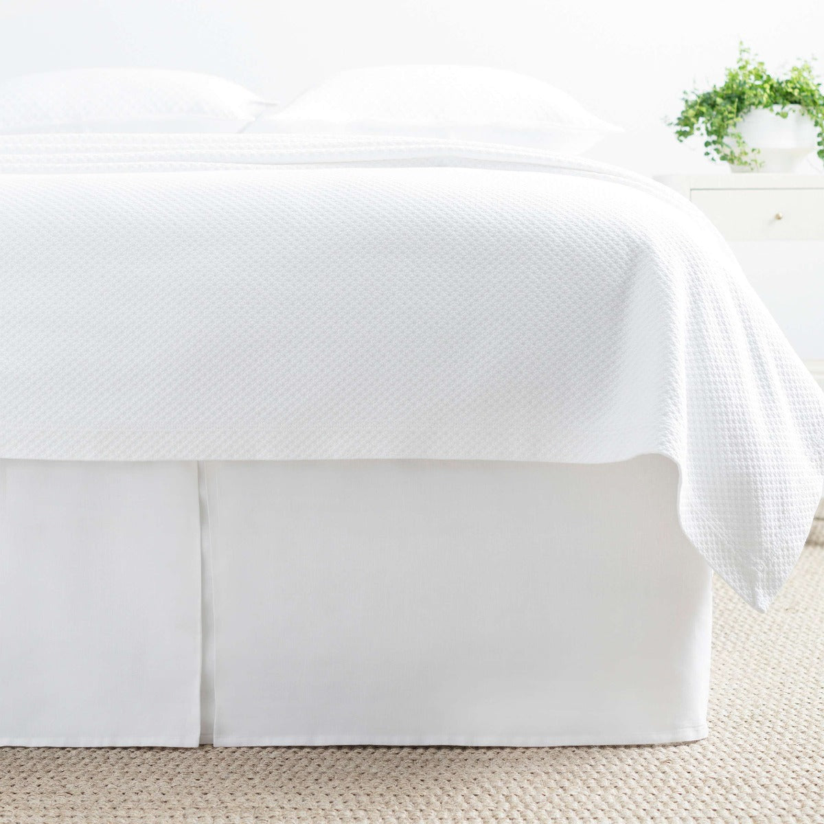 Lush Linen White Bed Skirt styled with white bedding. Styled view. 