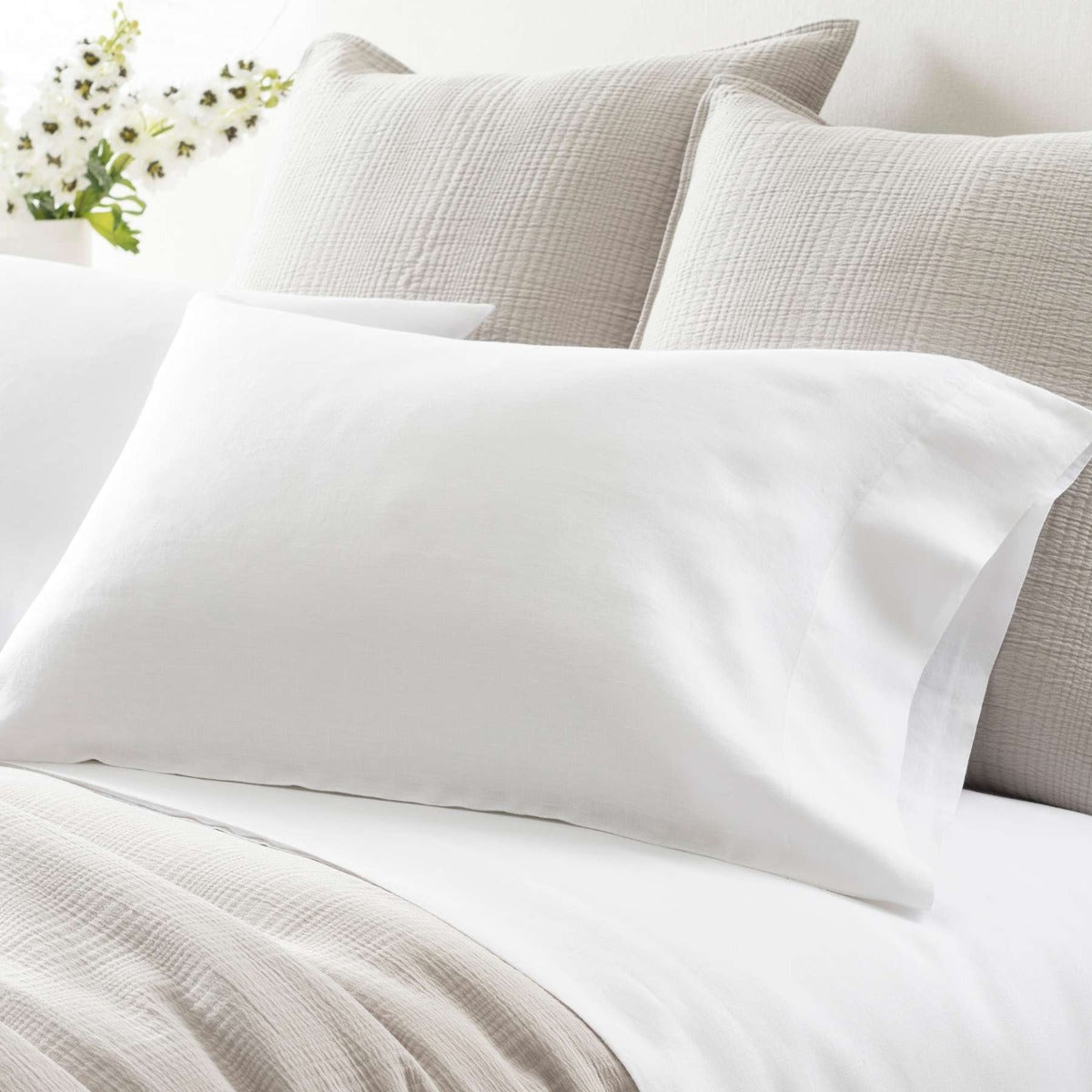 Lush Linen White Pillowcases styled with neutral bedding. Styled view. 