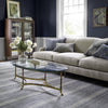 Malta Blue Woven Wool Rug styled in a blue living room. Styled view. 