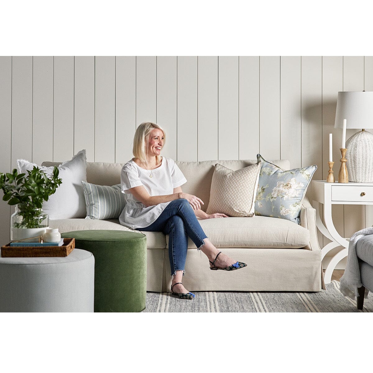 Margot Sofa styled with spring decor and ottomans. Styled view. 