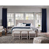 Magelian Glass Table Lamp styled in a light rustic bedroom with blue accents. Styled view.