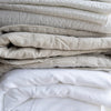 Montauk White Duvet Cover folded. Styled view. 