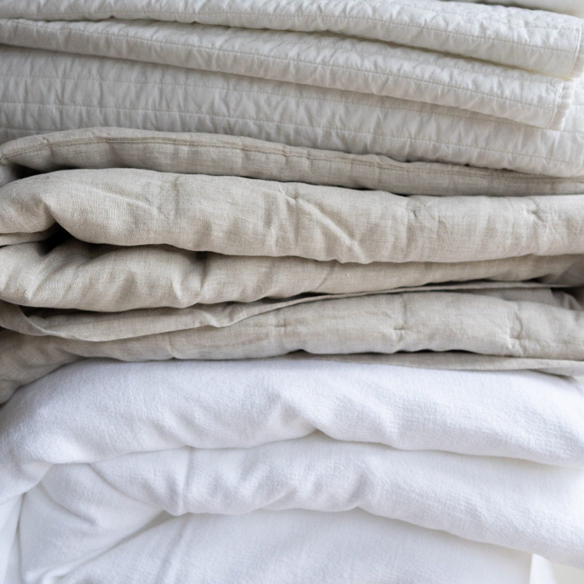 Montauk White Duvet Cover folded. Styled view. 