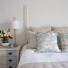 Montauk White Duvet Cover styled with blue pillows in a bedroom. Styled view. 