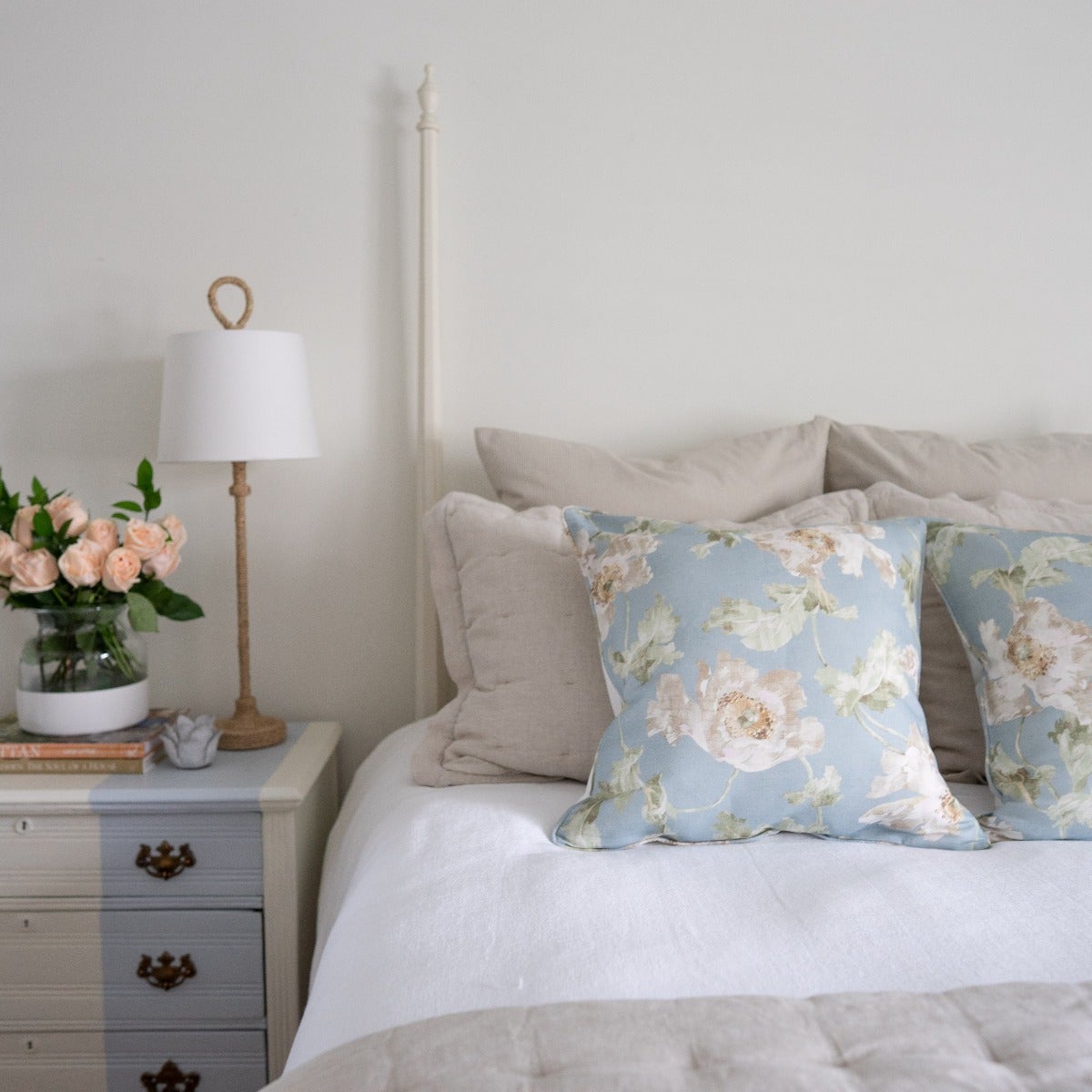 Montauk White Duvet Cover styled with blue pillows in a bedroom. Styled view. 