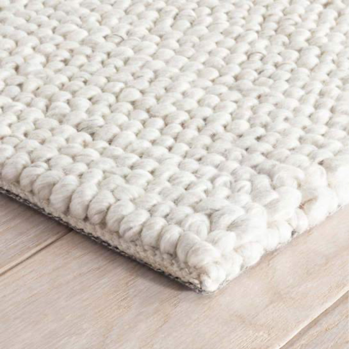 Niels Ivory Woven Wool/Viscose Rug corner detail. Close-up corner view. 