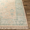 Ollie Rug styled over light wood floor. Styled view. 