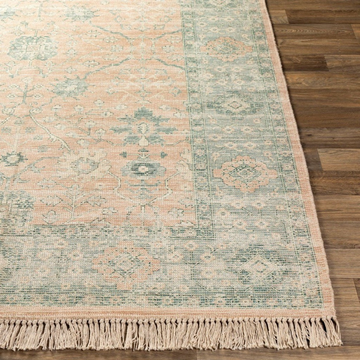 Ollie Rug styled over light wood floor. Styled view. 