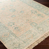 Ollie Rug styled over dark wood floor. Styled view. 