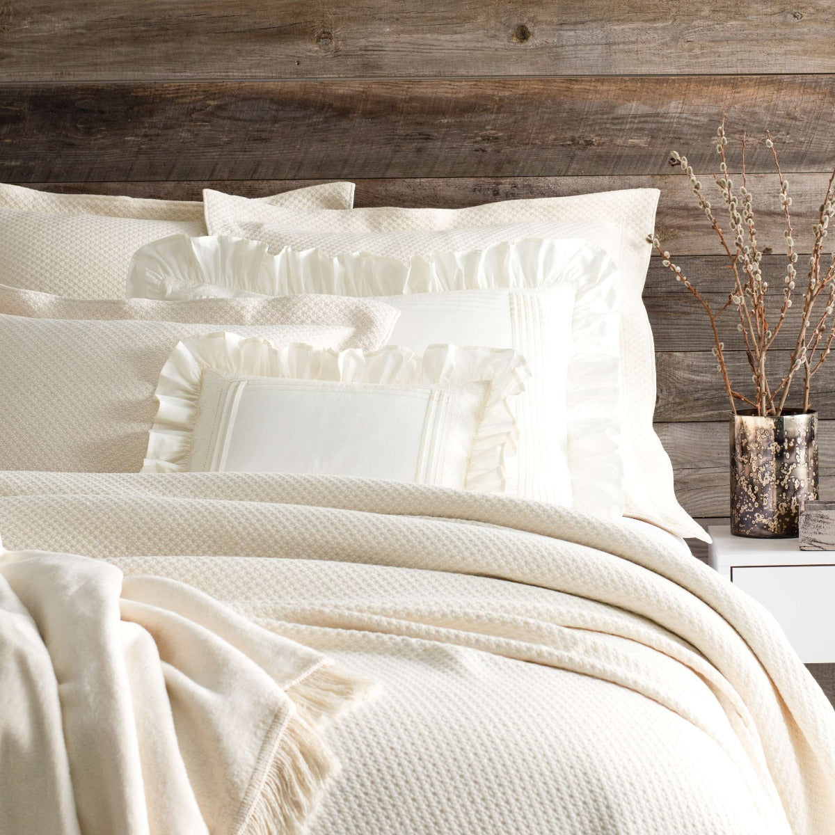 Petite Trellis Ivory Matelasse coverlet styled with ivory bedding. Styled view. 