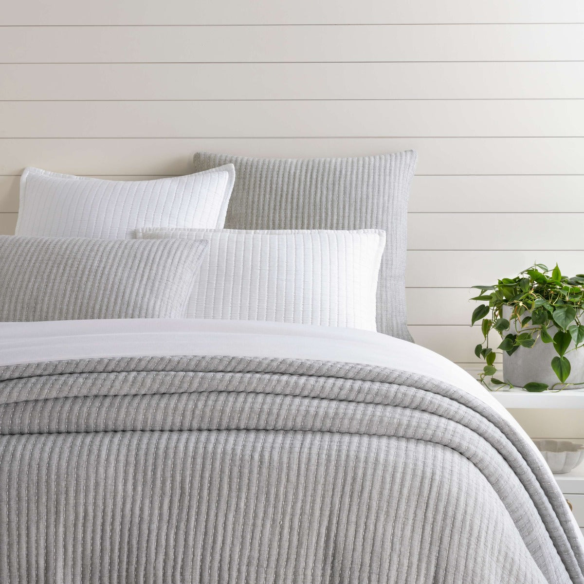 Pick Stitch Grey Matelasse Coverlet styled with white bedding. Styled view. 