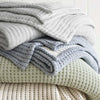 Pick Stitch Natural Matelasse Coverlet styled with bedding. Styled view. 