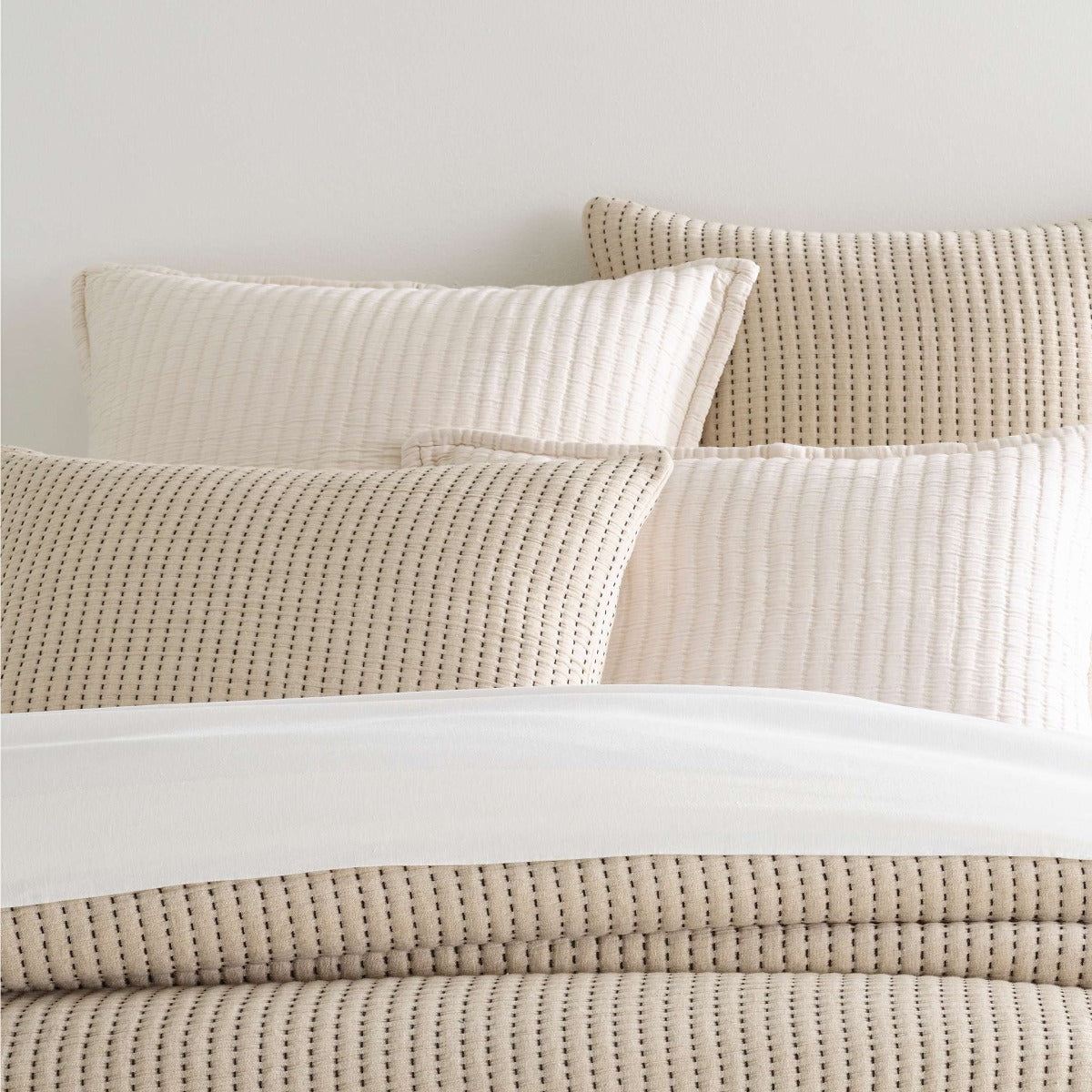 Pick Stitch Natural Matelasse Sham styled with neutral bedding. Styled view. 