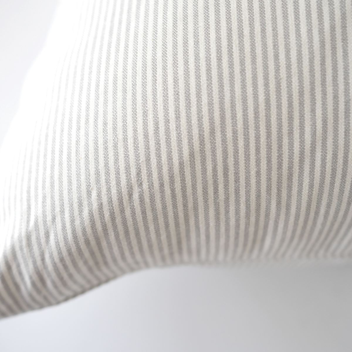 Pinstripe Pillow - Grey 22". Front view.