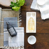 Rectangle Marble Tray - Medium styled with soaps on a wood table. Styled view. 